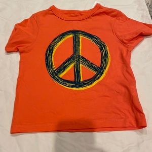 Orange shirt with peace sign